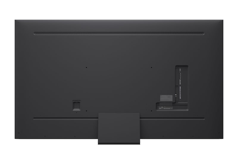 A girl and a dog are seated in front of a LG QNED TV mounted on a wall depicting three elephants walking outwards above a LG Soundbar. The title talks about how every action is more thrilling on a massive screen.