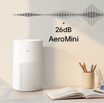 Một chiếc LG AeroMini đặt trên bàn cùng với một chiếc máy tính xách tay, hiển thị "26dB" và đồ họa sóng âm để làm nổi bật khả năng hoạt động yên tĩnh.
