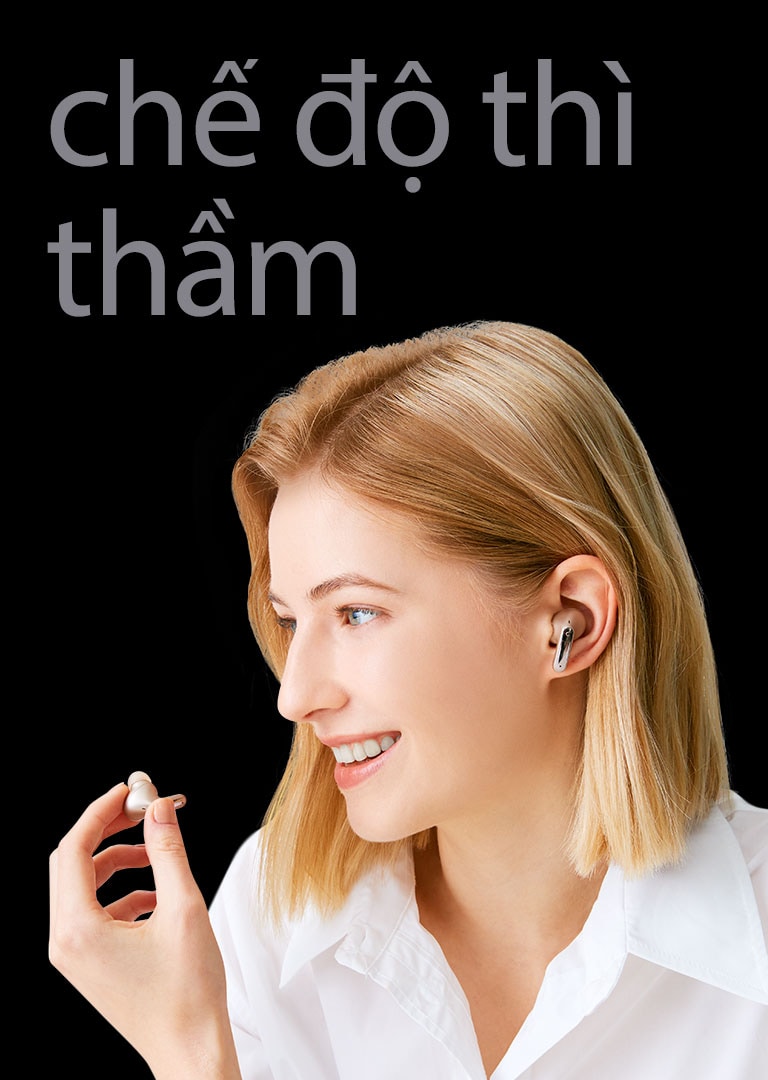 An image of a woman holding an earbud in her hand and making a call like a microphone.