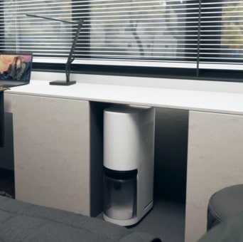 The LG dehumidifier is easily stored under the desk.