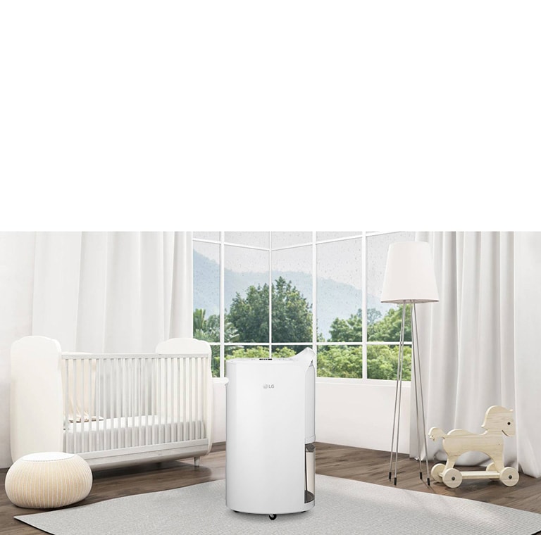 Modern nursery with LG air purifier centered, white crib left, floor lamp and rocking horse right, large windows behind.