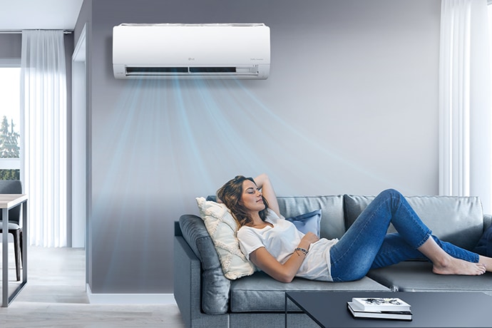 an air conditioner that breathes cool air on green grass