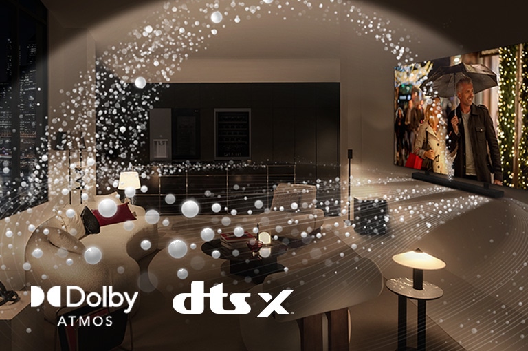 "A movie plays on an LG OLED TV and LG Soundbar in a modern city apartment in a side angle view. White beads depicting sound waves project upwards and downwards from the Soundbar and TV, creating a dome of sound in the space.  Dolby Atmos logo DTS X logo"