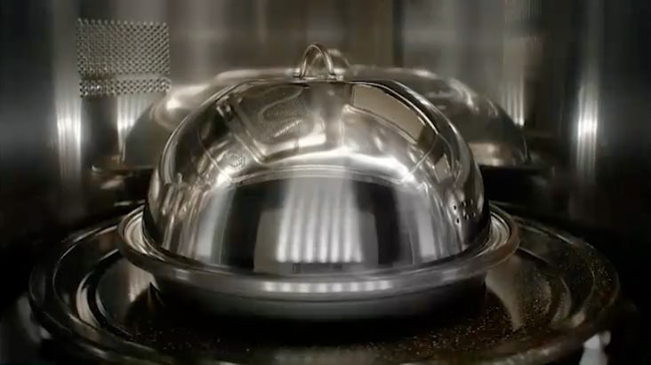 This image shows a reflective dome-shaped Steam Cover accessory placed inside SoalrDOM™.