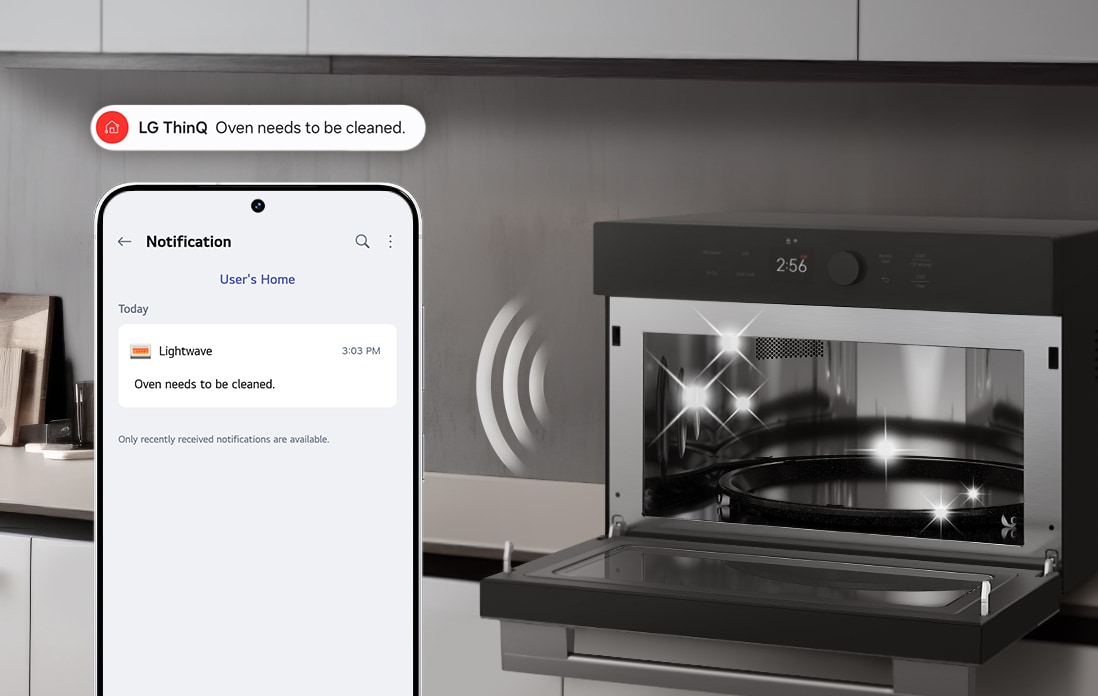 Image of a smartphone showing an LG ThinQ cleaning alert, next to an open cooking appliance with interior lights on