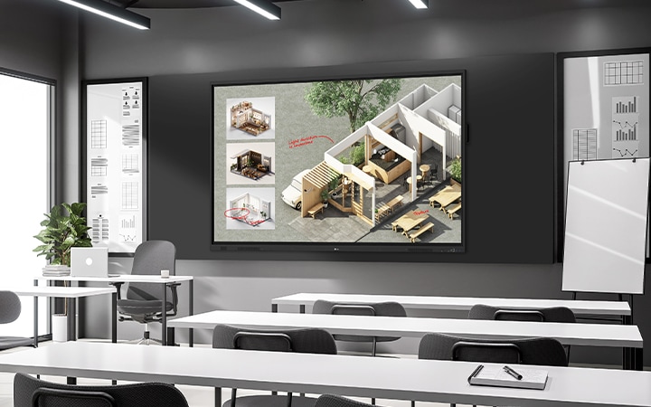 In the lecture room, there's a large interactive digital board installed on the wall, vividly displaying lecture materials on the screen.