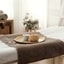 Spa treatment room with clean towels and calm interior, representing premium laundry quality
