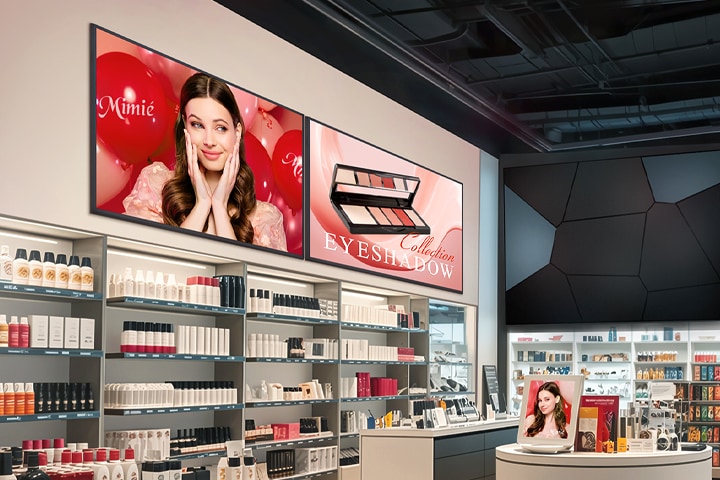 Inside the cosmetics shop, two UH7Q displays are mounted high on the wall, each vividly showcasing cosmetic advertisements.