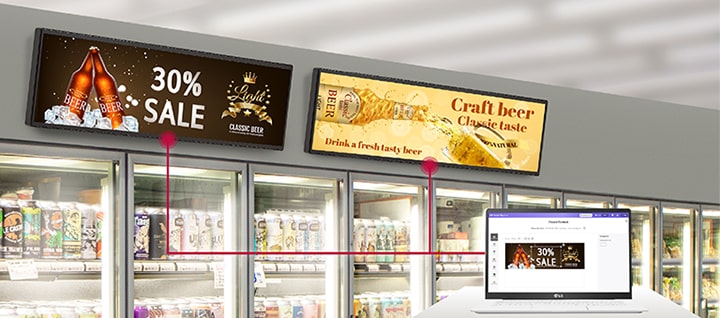 Esta imagem mostra uma página de soluções exibida em um laptop, demonstrando a criação de conteúdo e sua aplicação em displays de varejo.
