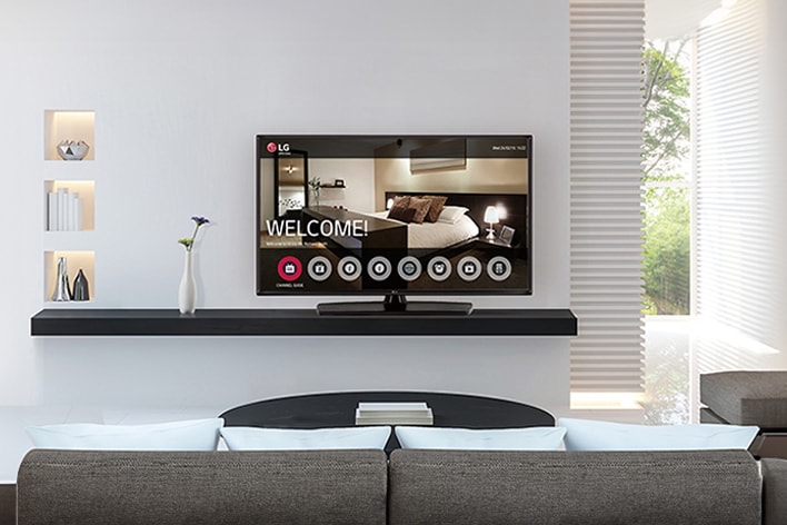 This image features a TV in a hotel room with a welcome message on display.	