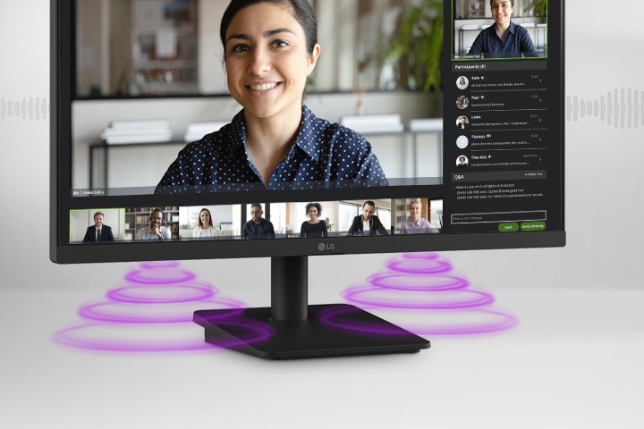 The monitor screen shows a video conference, while sound is coming from the speakers at the bottom of the monitor.