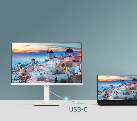 A photo showcasing a smart monitor connected to a laptop via USB-C, demonstrating charging and data transfer.