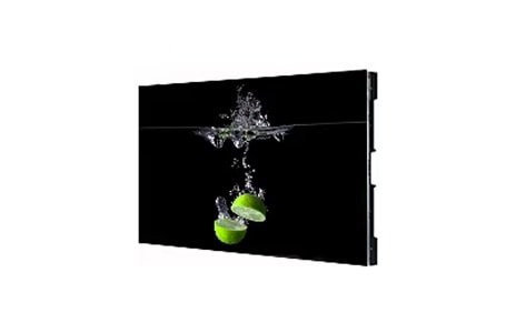 A digital display showing a vivid image of green lime halves splashing into water against a black background.
