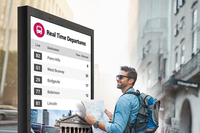 A man wearing sunglasses is checking the contents on the display.