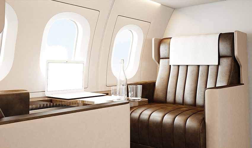 A comfortable airplane armchair and a notebook