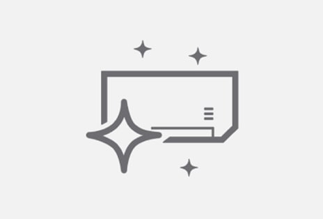 A rectangular air conditioning indoor unit surrounded by four glittering icons.