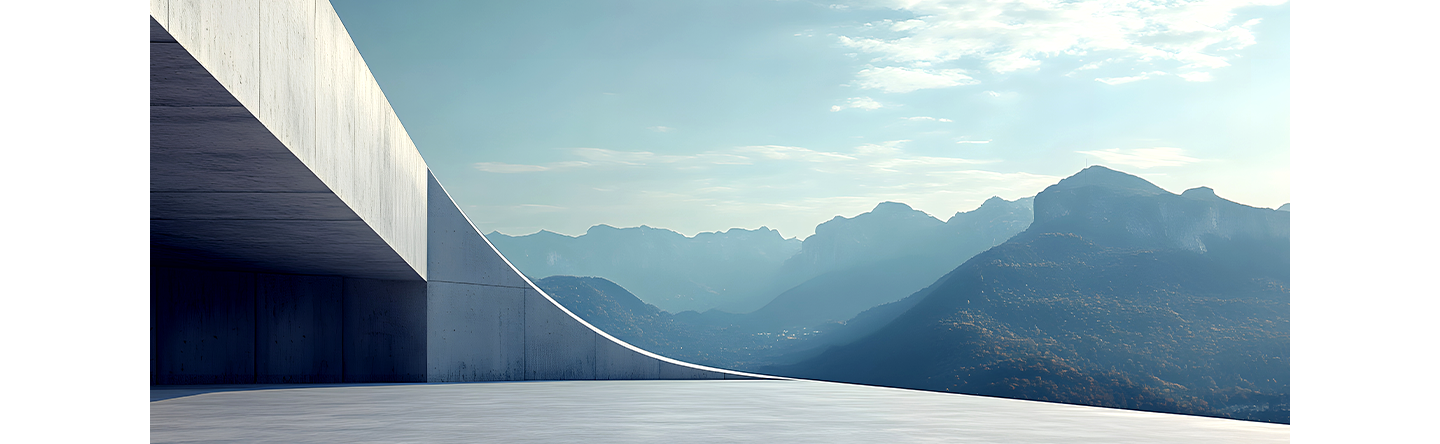 An image showing a landscape of a rooftop of a building surrounded by mountains.