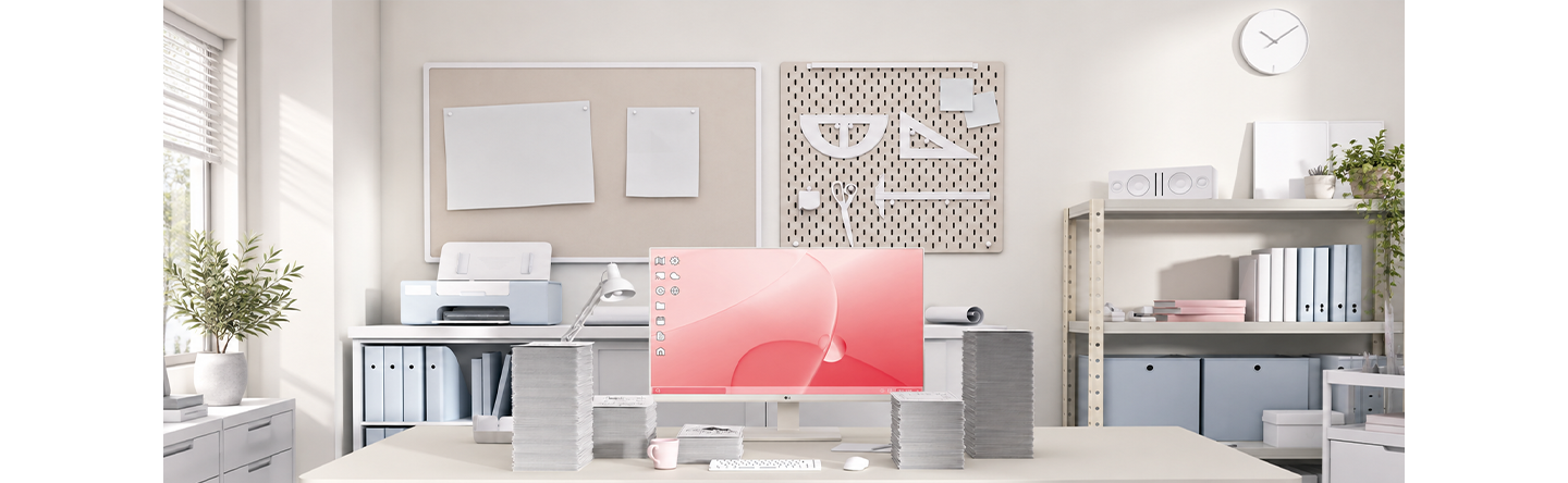 An image showing an office where stacks of documents piled up around the monitor.