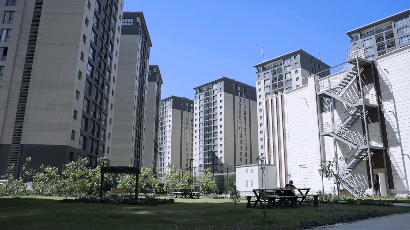 Inside view of Nasim City Residential Complex surrounded by residential buildings.
