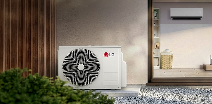 An LG residential outdoor air conditioning unit placed outside a home next to a sliding glass door.