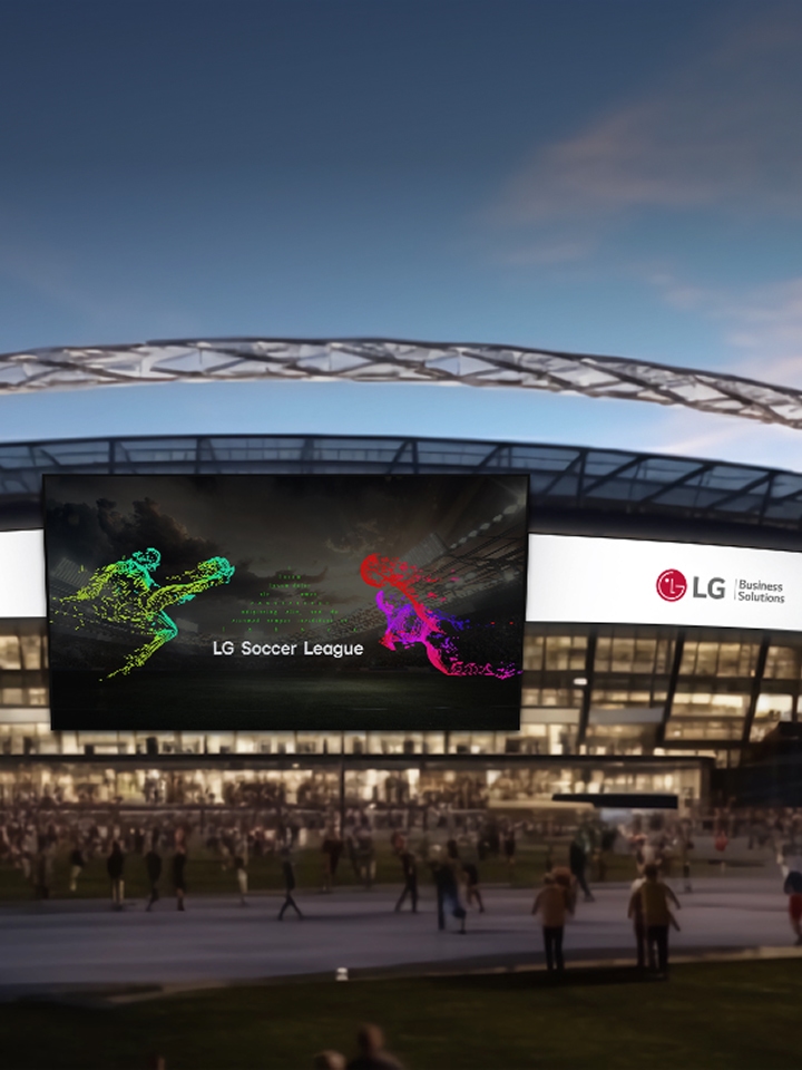 LG integrated public facility solutions visual showing a modern stadium exterior with large LG digital signage screens displaying “Life’s Good” and “LG Soccer League” for smart public spaces.