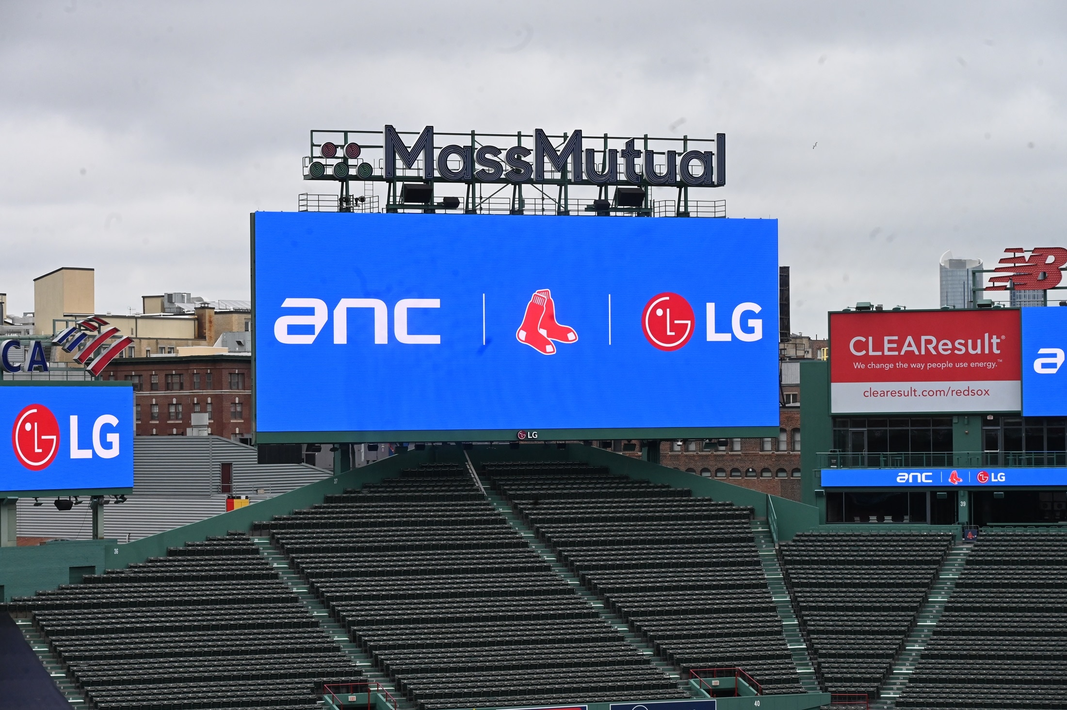 Large digital scoreboard at a stadium displaying ANC, Boston Red Sox logo, and LG logo