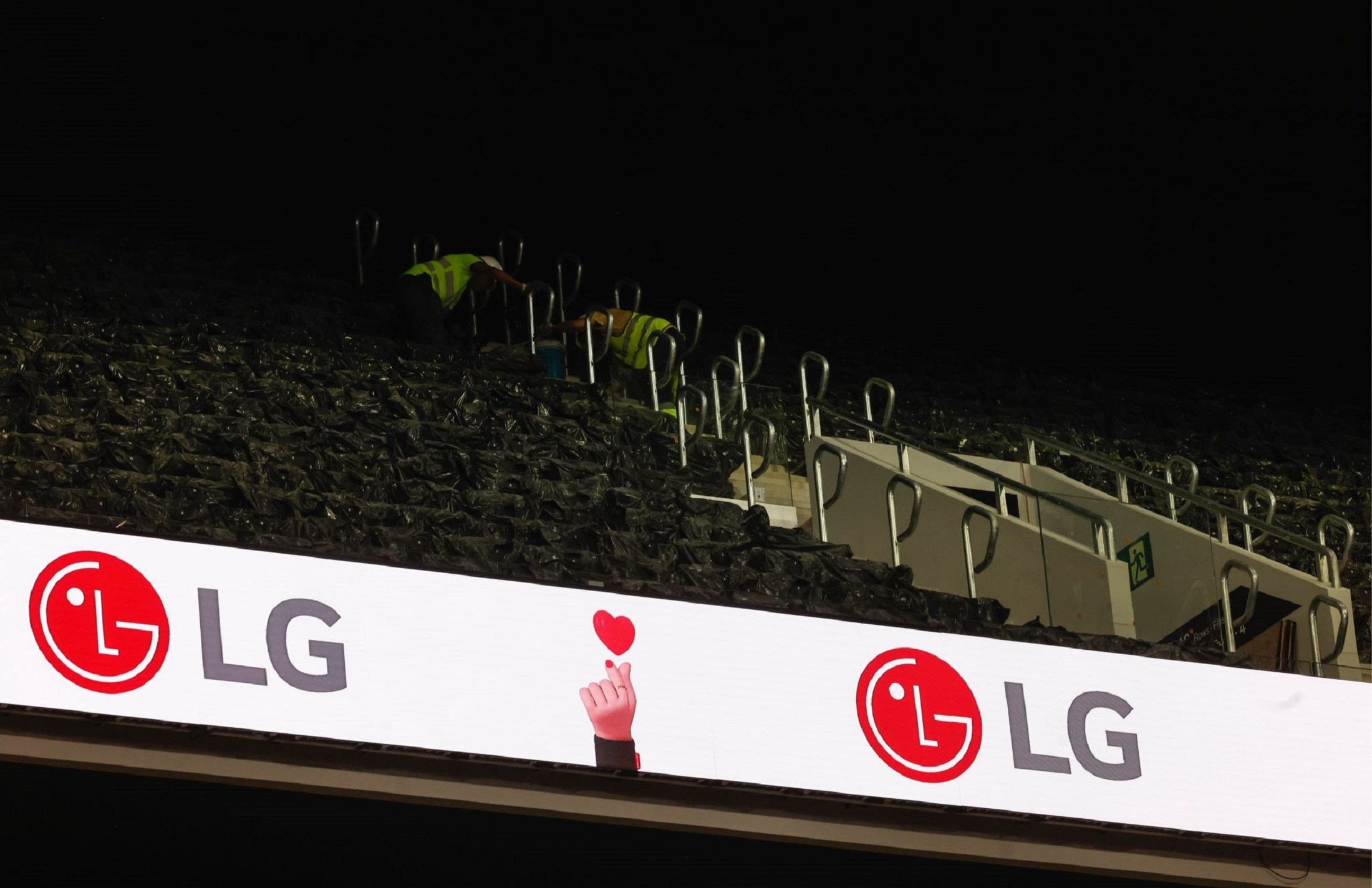 Close-up of LED signage in the stands at Roig Arena, prominently featuring the LG logo alongside animated icons