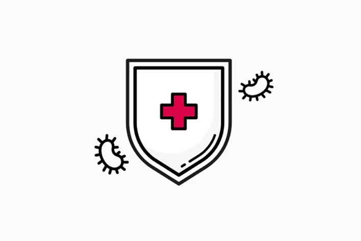 Shield with a medical cross symbol blocking bacteria, representing antimicrobial protection.