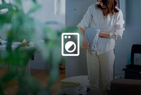Woman folding laundry at home