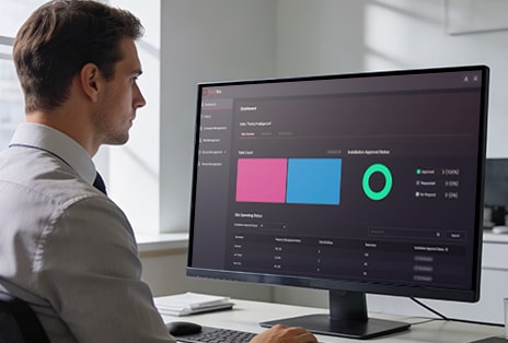 A professional reviewing a home analytics dashboard, representing LG's smart connected home management platform.