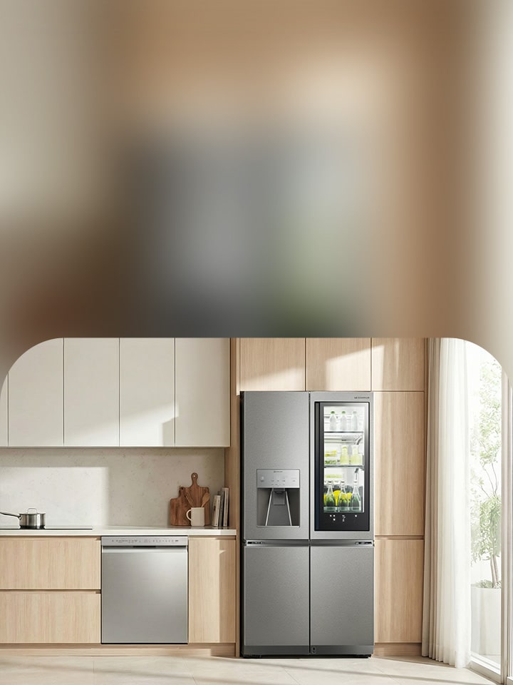 Premium residential kitchen with warm wood cabinetry featuring LG French door refrigerator and built-in dishwasher