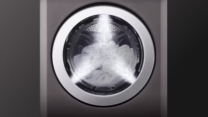 Close-up of washer drum with twin spray rinsing for quality service