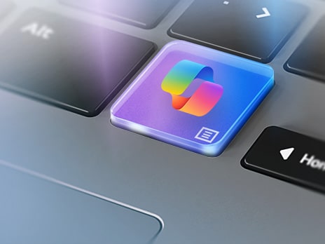 The image displays a close-up of a keyboard, focusing on a colorful key with the Windows Copilot icon.