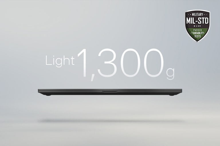 An animation showcasing a lightweight laptop with '1,290g' displayed in the first frame and '15.4mm' thickness in the second frame. Both frames include the MIL-STD durability badge, emphasizing portability and durability.