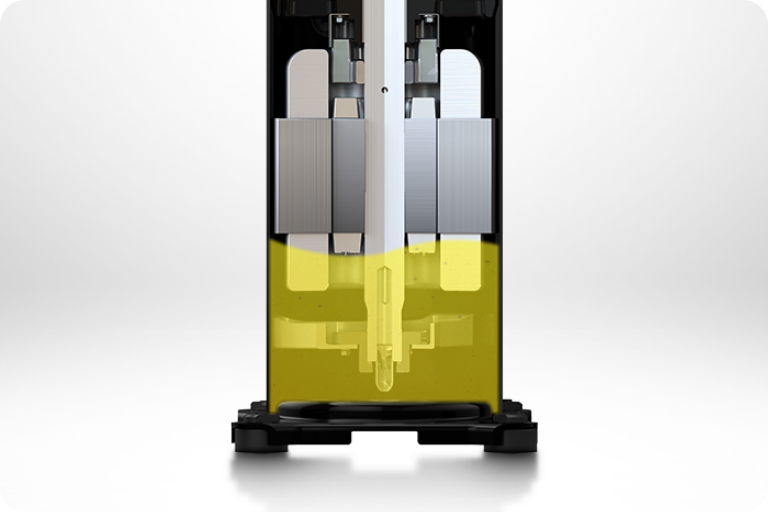 A close-up view of oil accumulated at the base of a compressor.