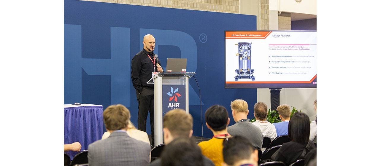 LG sales engineer discussing different components at product showcase