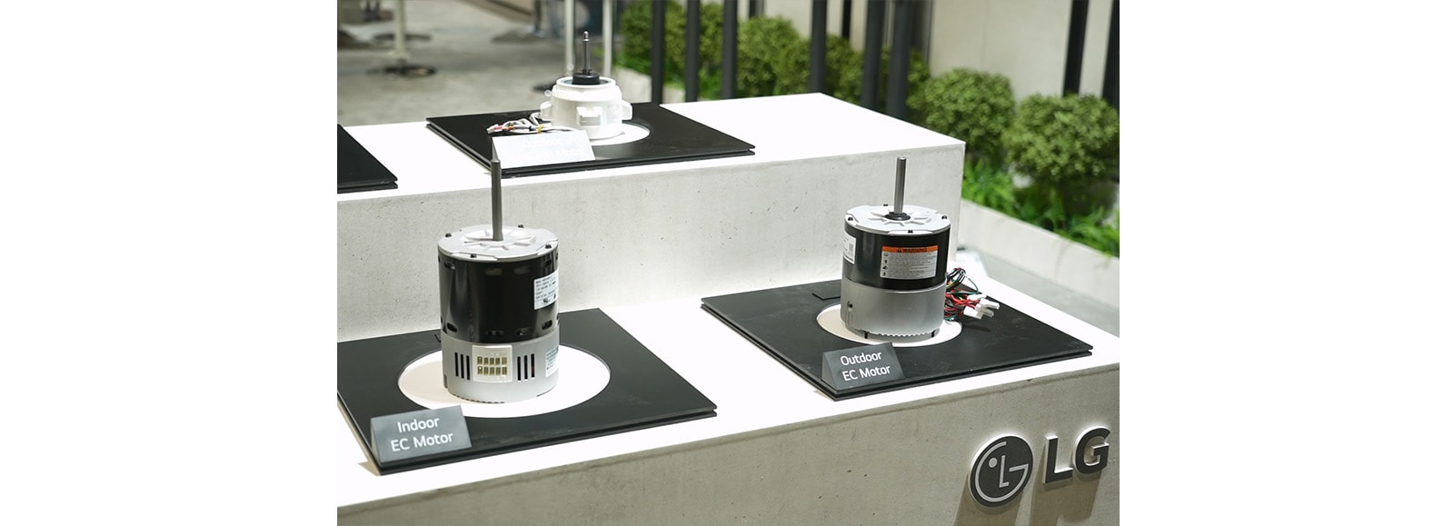 various LG motors lined up on a table at the AHR Expo in Chicago from January 21st to 24th, 2024.