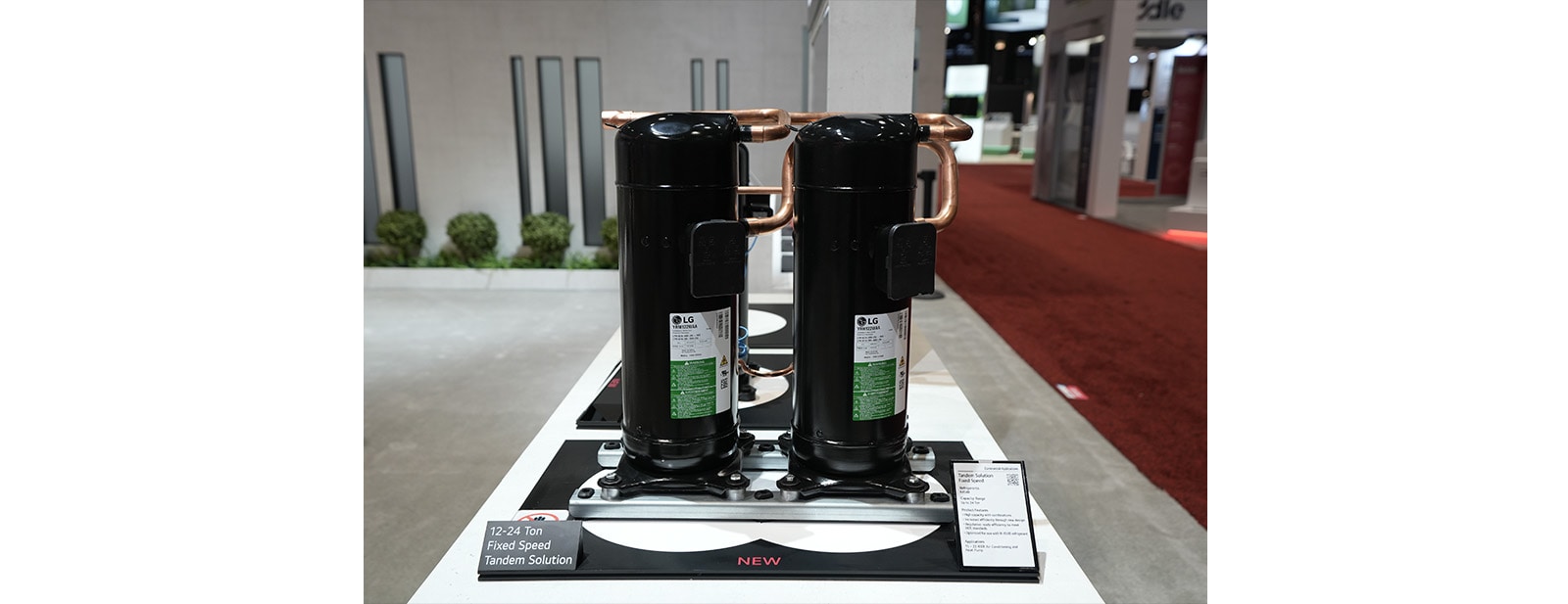 the tandem compressor on display at the LG compressors and motors booth at the AHR Expo in Chicago from January 21st to 24th, 2024.