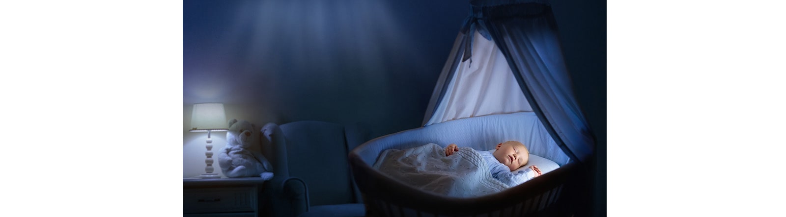 A baby is sleeping in a bedroom under the air conditioner.