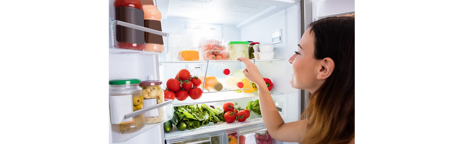 Woman Searching for Food in the Fridge