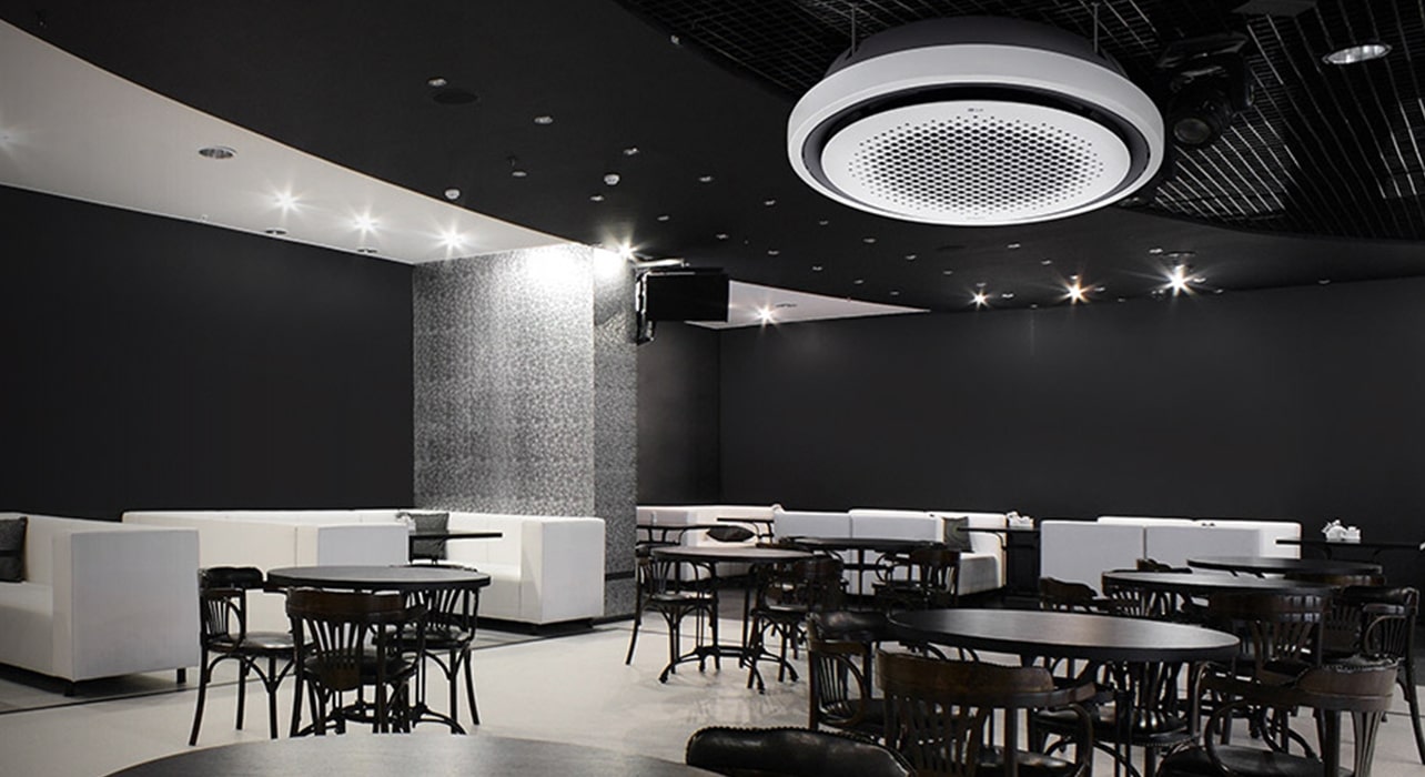 LG Round Cassette air conditioner installed in a stylish café interior, emphasizing sleek HVAC design and even airflow distribution. Showcases LG’s premium ceiling-mounted air solutions for commercial spaces.