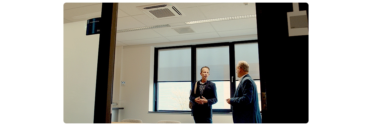 Modern office meeting room Netherlands professionals workplace air conditioning blinds corporate space natural light