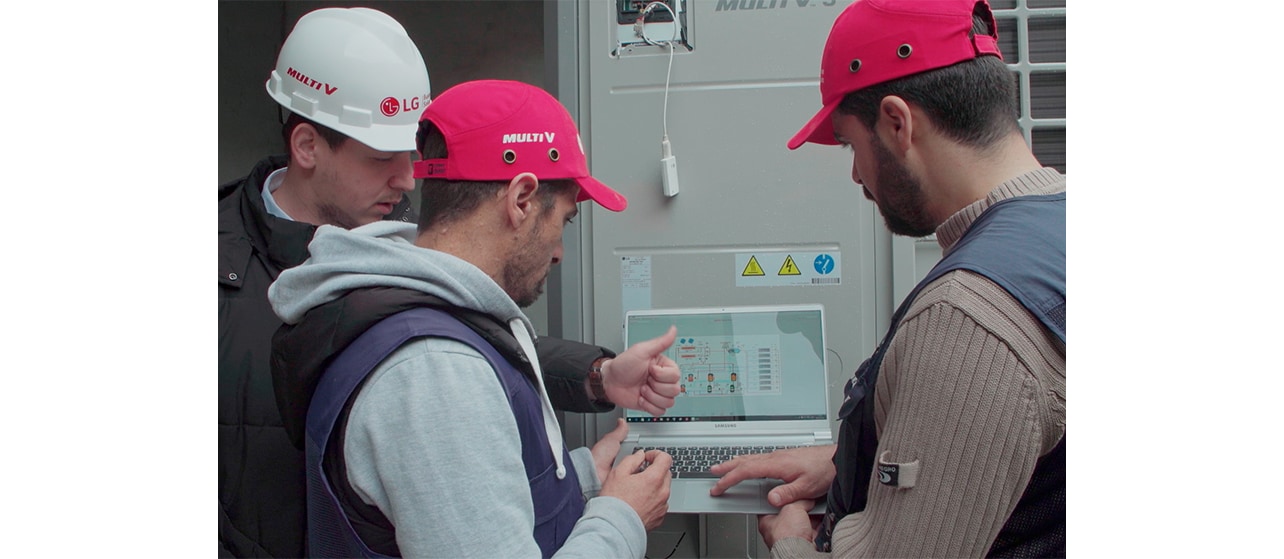 Three men are checking the system.