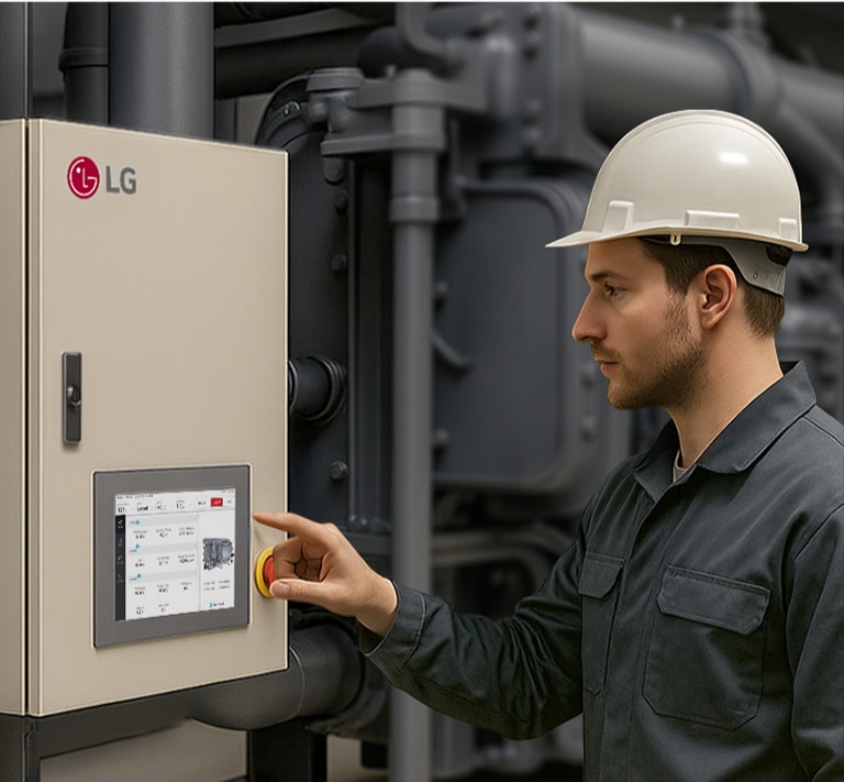 The Installer looks at and attempts to touch the LG Chiller Controller interface.