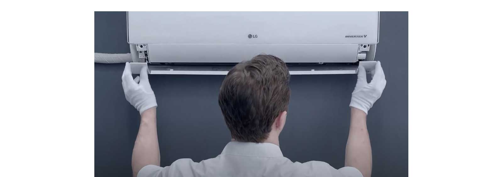 LG technician replacing indoor air conditioning unit parts with precision tools. Represents original LG replacement parts and professional service ensuring reliability and long-term performance.