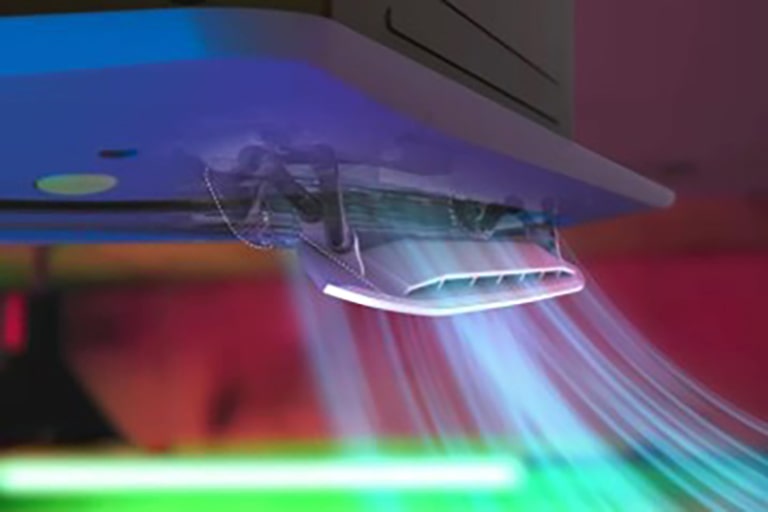 The solid white part of the dual vane is powerfully distributing a light blue airflow into the surrounding environment.