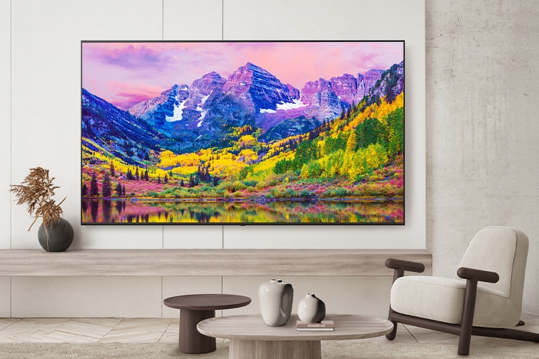 A TV on a hotel wall shows a bright and vivid screen.