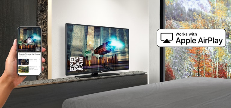 A hotel guest is pairing their iPhone with the in-room TV through AirPlay.