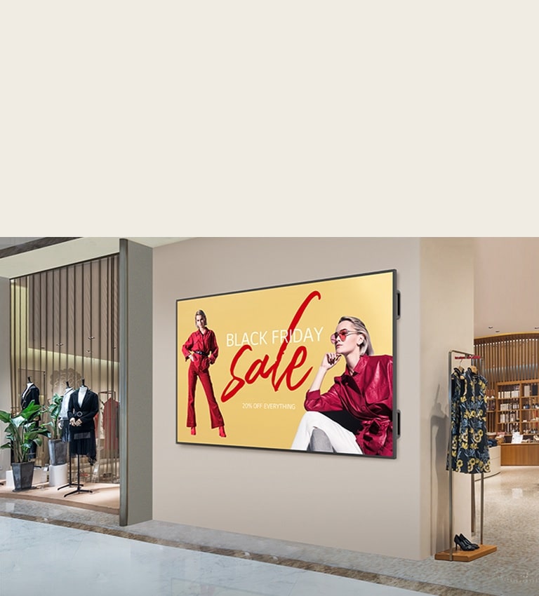 A large display is installed on a shopping mall’s interior wall, and the display’s screen is showing advertisements clearly and vibrantly.
