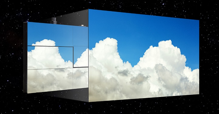 The LG MAGNIT screen, with minimal gaps between modules, shows the blue sky and puffy clouds without color deviation.